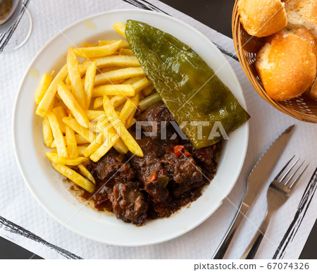 Beef in red wine with fries 67074326