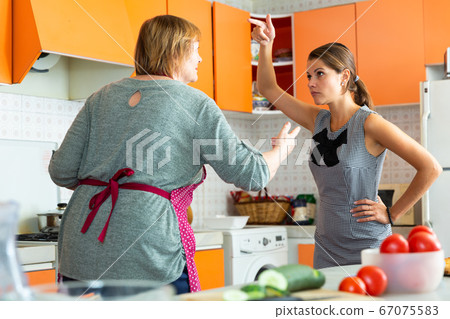 Angry mature female having conflict with unhappy daughter 67075583