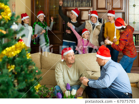 Happy big family is meeting for celebration New Year together at home Happy big family is meeting for celebration New Year together at home 67075705
