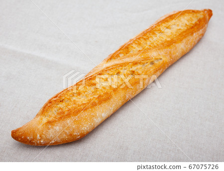 Freshly baked French baguette Freshly baked French baguette 67075726