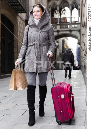 female with baggage in hood female with baggage in hood 67075764