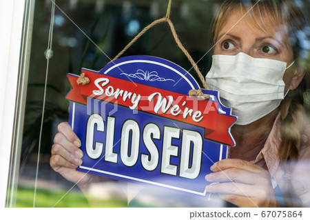 Female Store Owner Wearing Medical Face Mask Female Store Owner Wearing Medical Face Mask 67075864