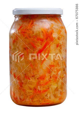 Glass jar with shredded fermented cabbage Glass jar with shredded fermented cabbage 67075866