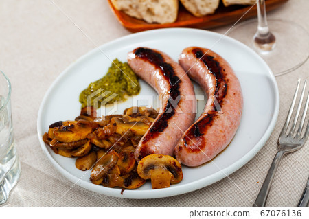 Grilled sausages with mushrooms Grilled sausages with mushrooms 67076136