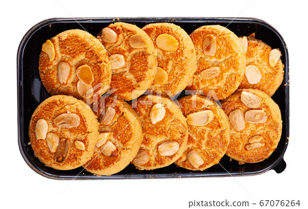 Plastic tray with almond cookies 67076264