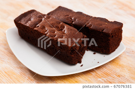 Fresh brownie on wooden table Fresh brownie on wooden table 67076381