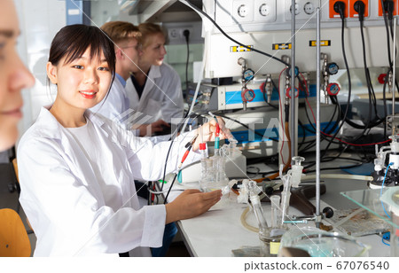 Serious Chinese female scientist at lab Serious Chinese female scientist at lab 67076540