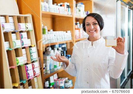 Woman pharmacist in store Woman pharmacist in store 67076608