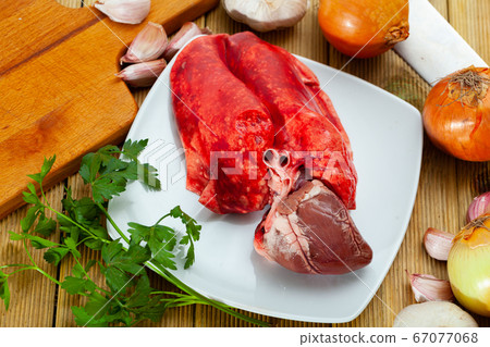 Raw lamb lungs and heart served with greens, nobody Raw lamb lungs and heart served with greens, nobody 67077068