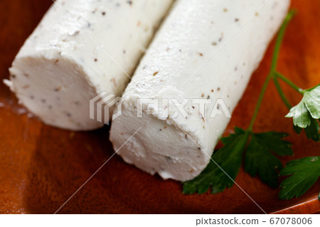 Soft goat cheese with herbs and garlic Soft goat cheese with herbs and garlic 67078006