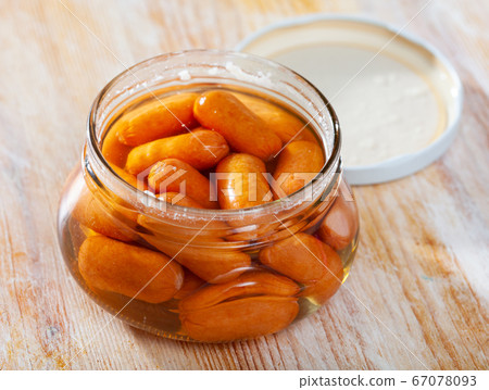 Close-up of meat sausages canned in glass jar Close-up of meat sausages canned in glass jar 67078093