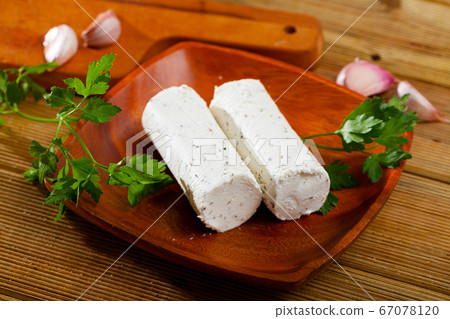 Soft goat cheese with herbs and garlic Soft goat cheese with herbs and garlic 67078120