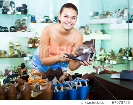 Girl searching for pair of new shoes 67078700