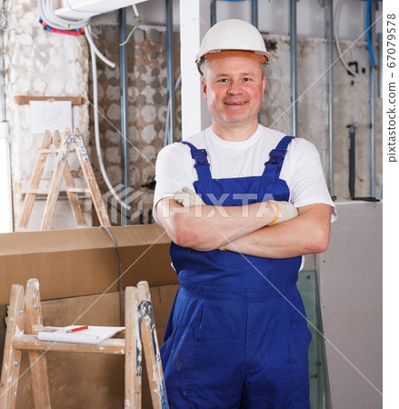 Happy male contractor Happy male contractor 67079578