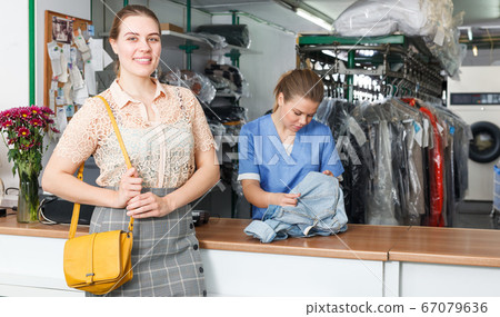 Satisfied client of dry cleaner Satisfied client of dry cleaner 67079636