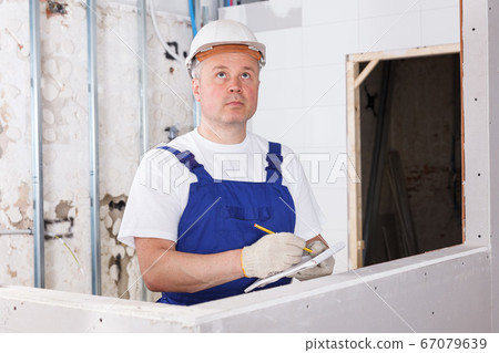 Builder planning construction works Builder planning construction works 67079639