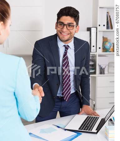 Manager meeting client with handshake Manager meeting client with handshake 67080757