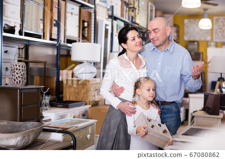 husband wife and daughter is choosing furniture husband wife and daughter is choosing furniture 67080862
