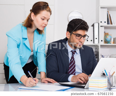 Business partners working in office Business partners working in office 67081150