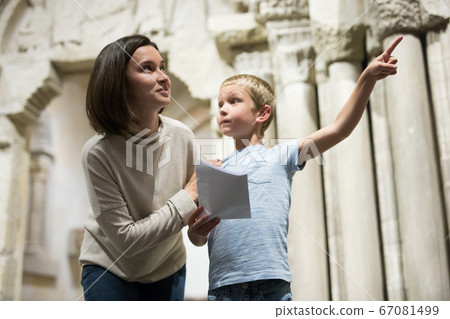 Woman and boy observing sculptures exhibition Woman and boy observing sculptures exhibition 67081499