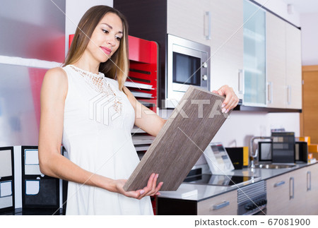 Positive woman looking for stylish kitchen fronts Positive woman looking for stylish kitchen fronts 67081900