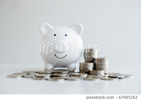 Piggy bank with a pile of coins Steps into a business that is growing to be successful and economical for retirement concepts 67085262