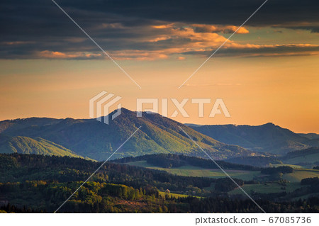 Mountainous landscape at sunset at spring time. Mountainous landscape at sunset at spring time. 67085736