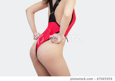 Beautiful woman wear swimsuit isolated on cream 67085959