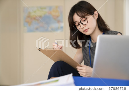 Young woman working in the office 67086716