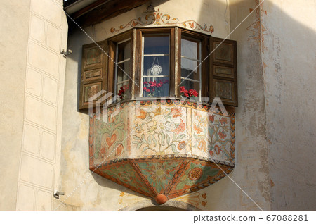 Ancient balcony with wooden windows - Guarda village Engadine Switzerland Ancient balcony with wooden windows - Guarda village Engadine Switzerland 67088281