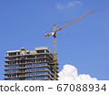 A crane on the construction of a new house. 67088934