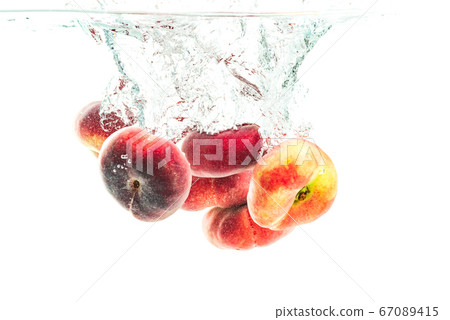 Bunch of doughnut peaches isolated on white, 67089415