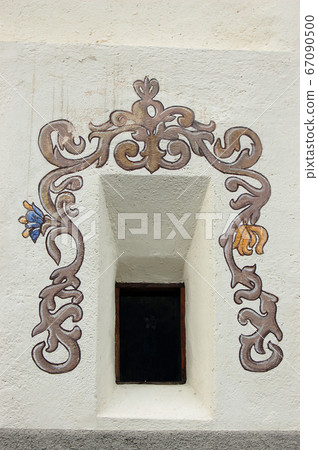 Small window with fresco in the Guarda village Engadine Switzerland 67090500