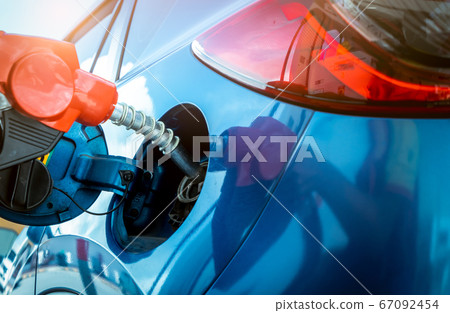 Car fueling at gas station. Refuel fill up with 67092454
