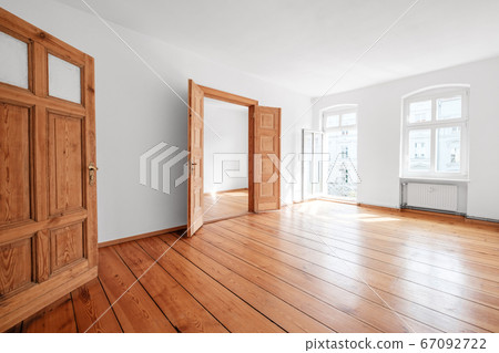 empty living room in apartment flat with wooden floor and balcony - 67092722