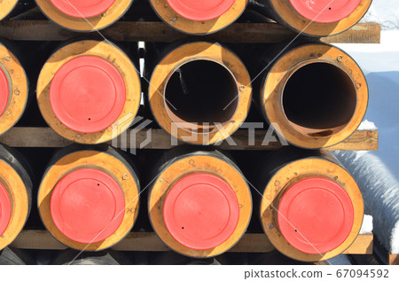 Construction Materials. Industrial pipes under snow. Construction Materials. Industrial pipes under snow. 67094592