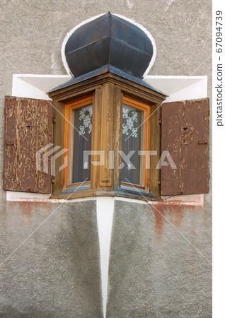 Ancient balcony with wooden windows - Zuoz village Engadine Switzerland Ancient balcony with wooden windows - Zuoz village Engadine Switzerland 67094739
