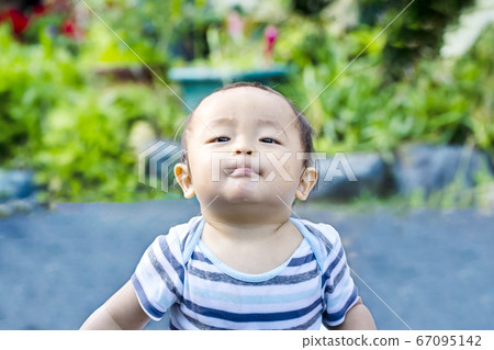A child playing outside and feeling proud and euphoric. A child soaking wet in the water. A child playing outside and feeling proud and euphoric. A child soaking wet in the water. 67095142