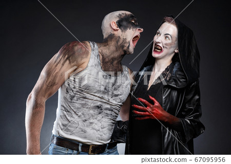 Photo of screaming mad man and scary woman with blood hands Photo of screaming mad man and scary woman with blood hands 67095956