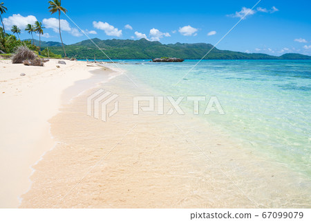 Tropical beach blue sky and turquoise ocean in Tropical beach blue sky and turquoise ocean in 67099079
