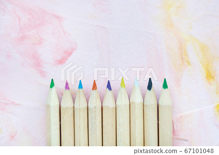 Multicolored pencils on pink background Multicolored pencils on pink background 67101048