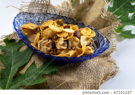 Cornflake caramel on a glass cup 67101287