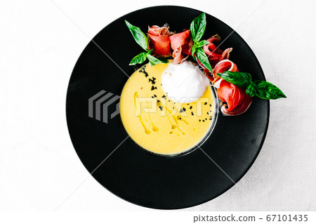 A close up of a plate of pumpkin soup A close up of a plate of pumpkin soup 67101435