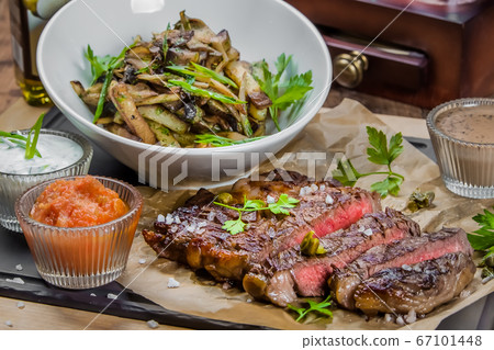 A bowl of steak on a table A bowl of steak on a table 67101448