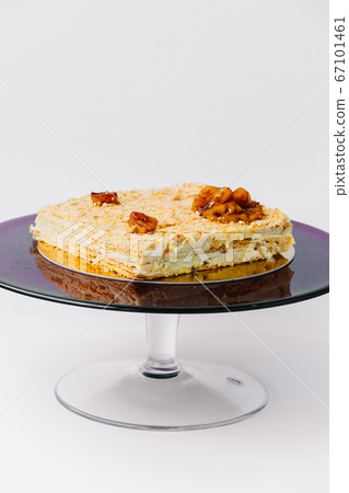 A piece of Napoleon cake on a plate 67101461