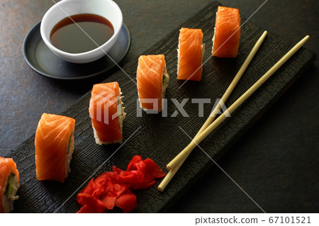 Sushi rolls. Dark style. Serving a meal at a Japanese restaurant. Top view with space to copy Sushi rolls. Dark style. Serving a meal at a Japanese restaurant. Top view with space to copy 67101521