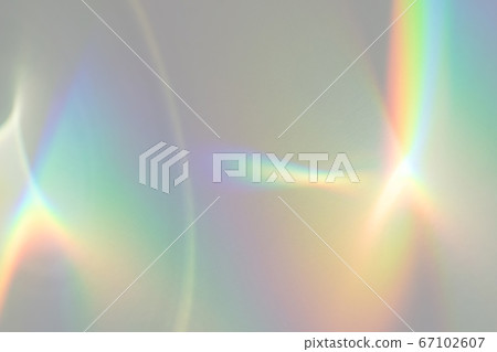 Blurred rainbow light refraction texture on white 67102607