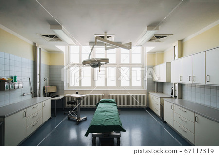 Interior view of operating room without any people or doctors Interior view of operating room without any people or doctors 67112319