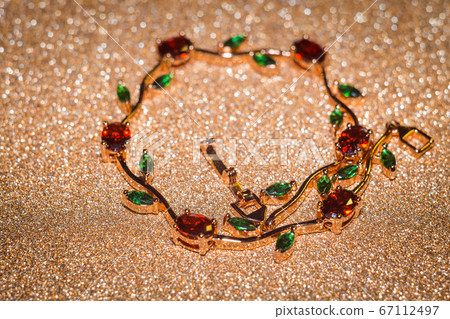 Bracelet with red and green zircons 67112497