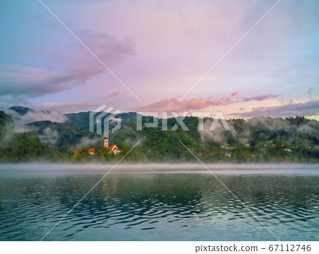 Picturesque view to the Bled lake with Pilgrimage Church of the Assumption of Maria at Bled island, Bled, Slovenia Picturesque view to the Bled lake with Pilgrimage Church of the Assumption of Maria at Bled island, Bled, Slovenia 67112746